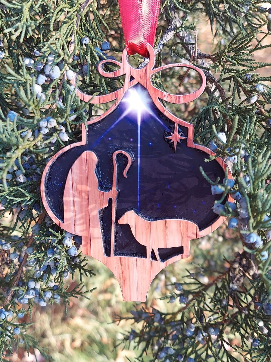 Shepherd and Sheep Christmas Ornament – Layered MDF Nativity Design 1 Shepherd and Sheep Christmas ornament featuring a layered MDF design with rustic wood-look cutouts, a shepherd and sheep, and a starry night background.