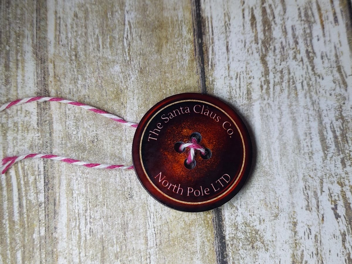 Santa's Lost Button – Personalized Christmas Eve Letter & Keepsake 5 Santa's Lost Button A round red button lying on a brown wood grain background